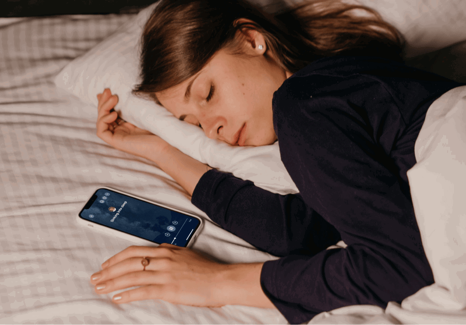 Woman sleeping while listening to a sleep meditation