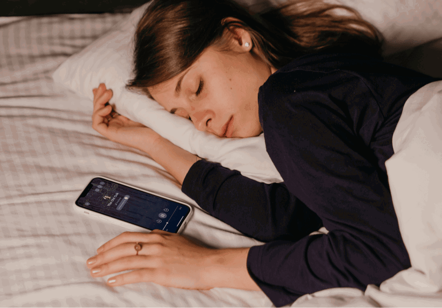 Woman sleeping while listening to a sleep meditation